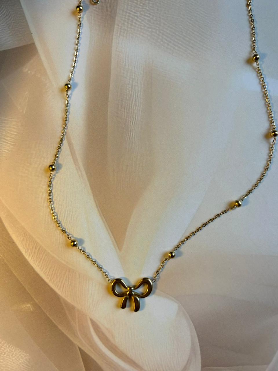 ✨ Elegant Golden Bow Pendant Necklace – Minimal & Chic Design