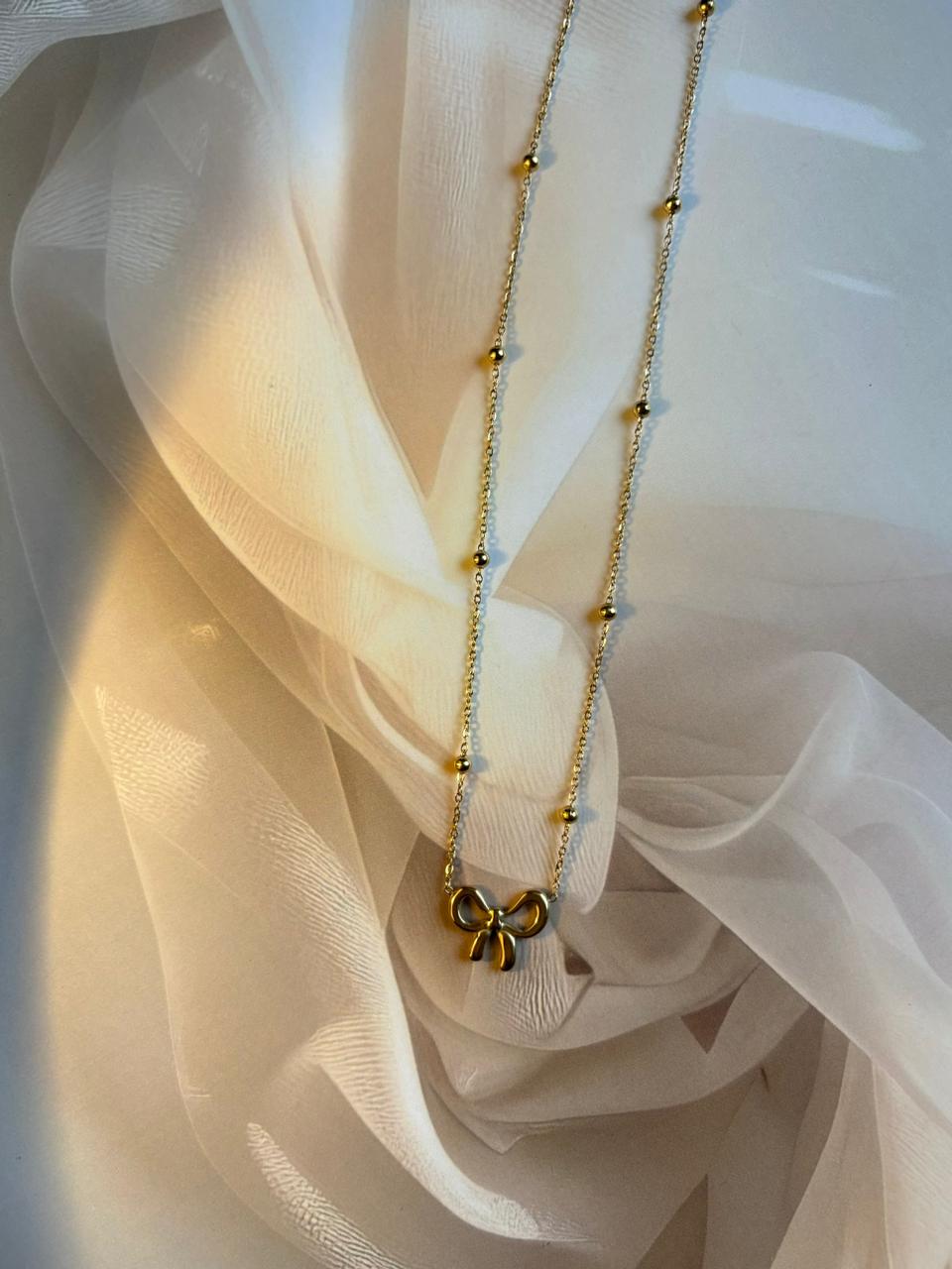 ✨ Elegant Golden Bow Pendant Necklace – Minimal & Chic Design