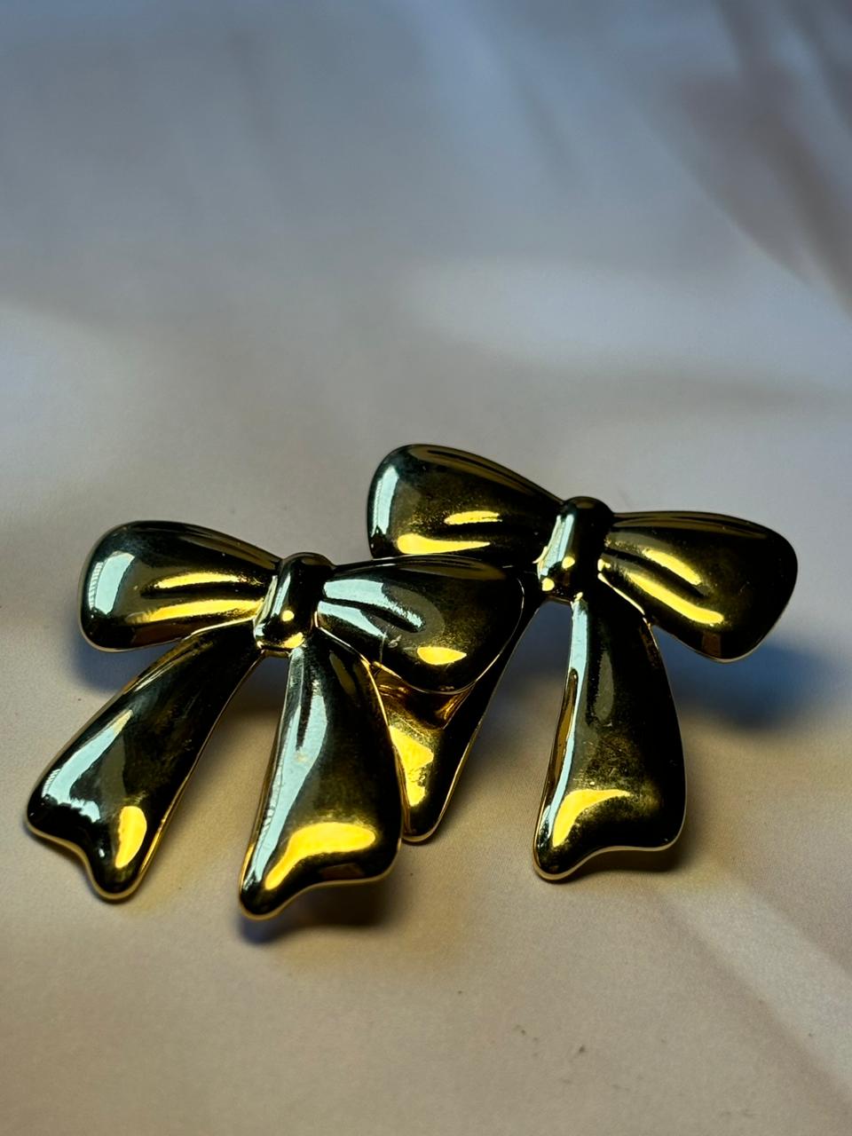 Golden Bow Knot Stainless Steel Earrings – Elegant & Stylish